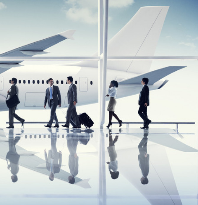 multiethnic-group-of-business-people-with-airplane-xs.jpg